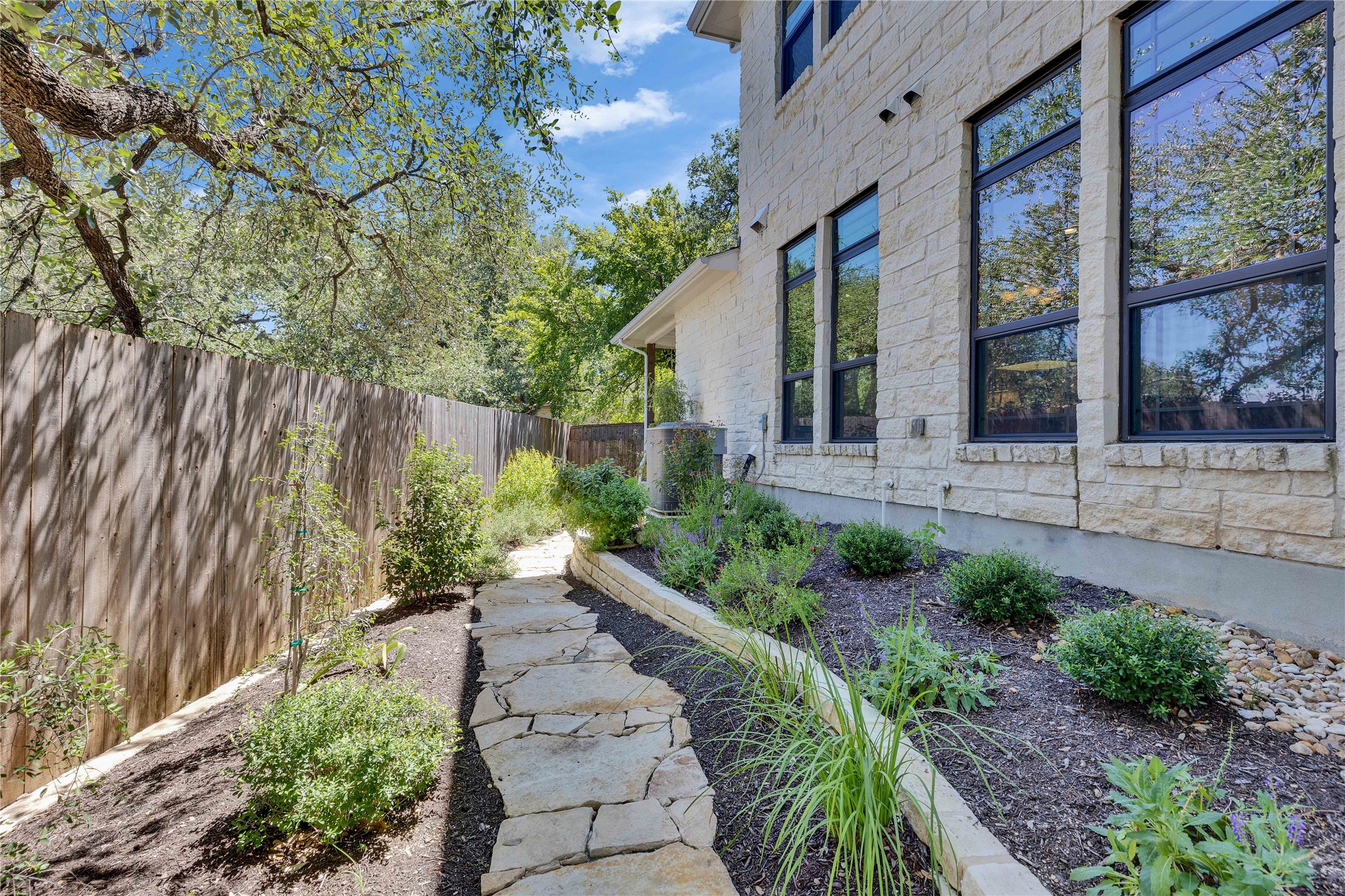 4323 Spicewood Springs Road, Unit 1 Austin, TX 78759 - Photo 32 of 35 a view of a backyard with potted plants