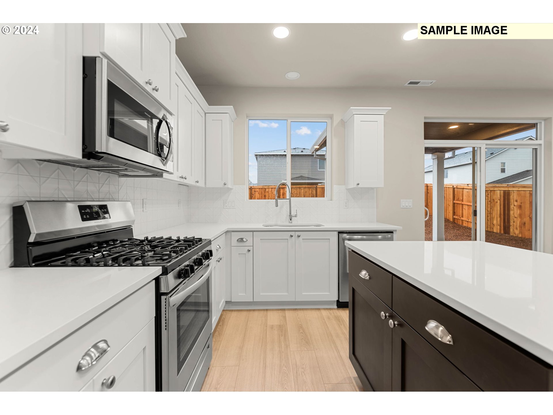 3118 South Magnolia Street, Unit LT752 Cornelius, OR 97113 - Photo 20 of 41 a kitchen with stainless steel appliances granite countertop a sink stove and cabinets