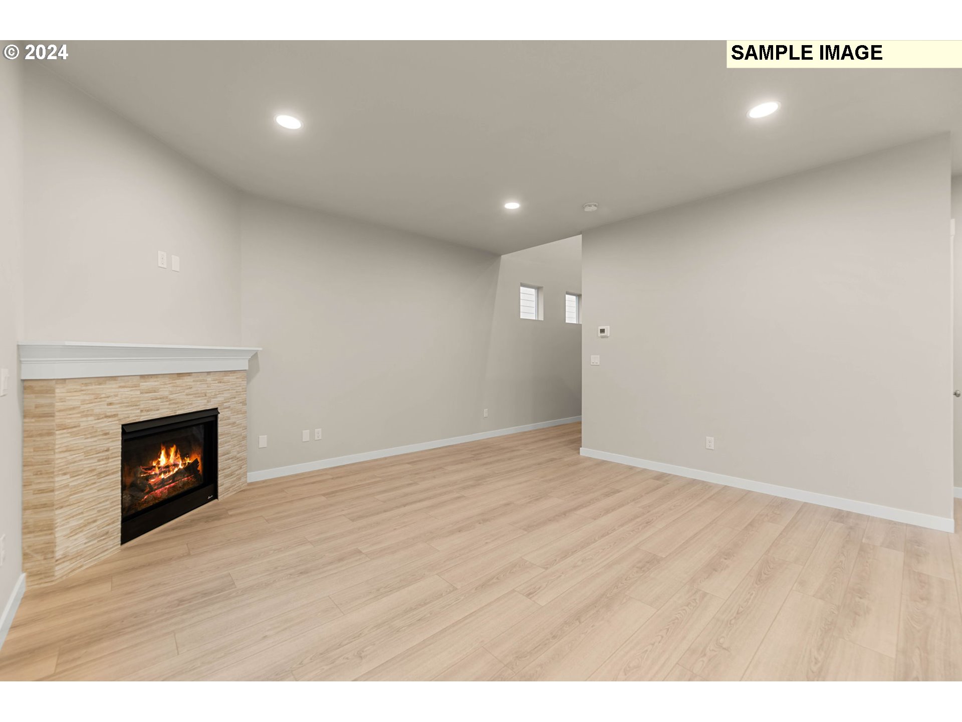 3118 South Magnolia Street, Unit LT752 Cornelius, OR 97113 - Photo 6 of 41 a view of an empty room with wooden floor fireplace and a window