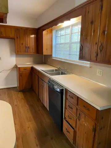 a kitchen with a stove a sink and a refrigerator