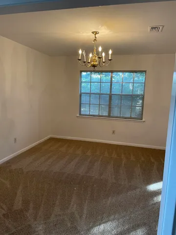 a view of a room with a chandelier