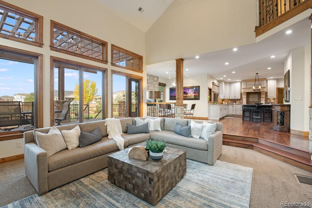 6570 Rookery Road Fort Collins, CO 80528 - Photo 11 of 40 a living room with furniture and a large window