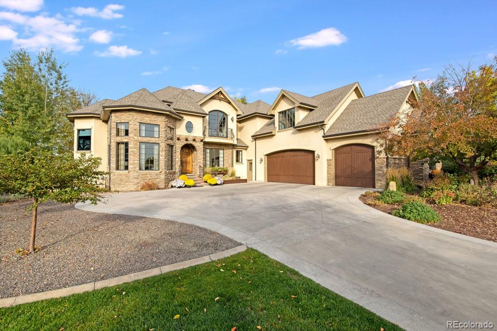 6570 Rookery Road Fort Collins, CO 80528 - Photo 2 of 40 a front view of a house with garden