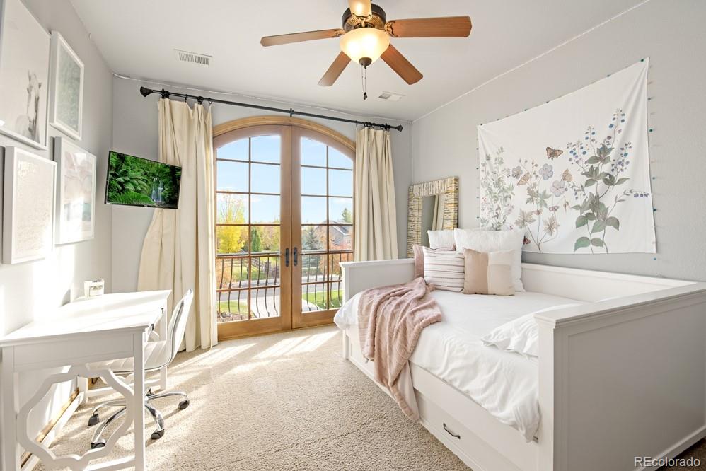 6570 Rookery Road Fort Collins, CO 80528 - Photo 23 of 40 a bedroom with a large bed and a window