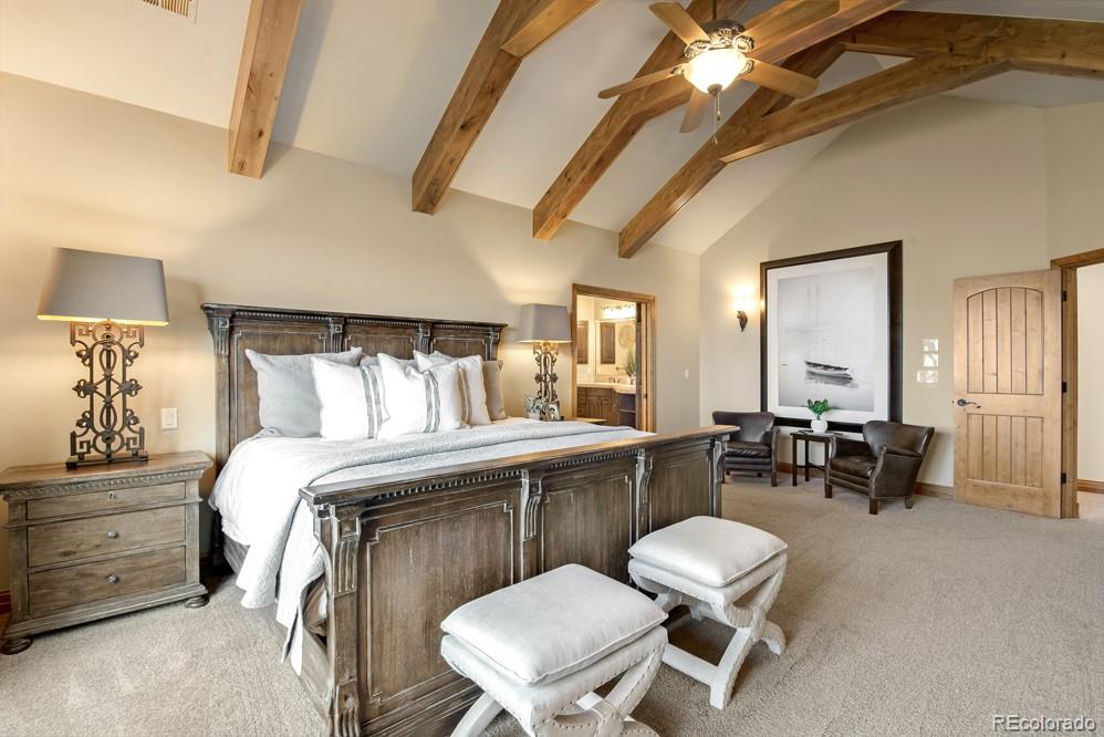 6570 Rookery Road Fort Collins, CO 80528 - Photo 29 of 40 a bed room with a bed and a chair