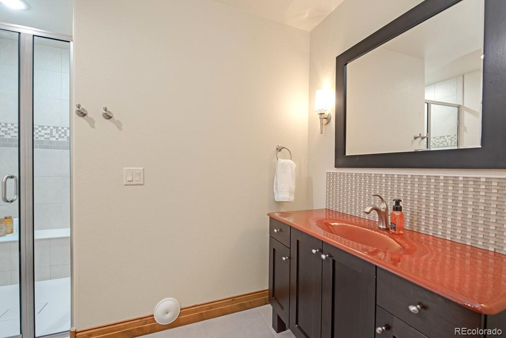 6570 Rookery Road Fort Collins, CO 80528 - Photo 35 of 40 a bathroom with a sink and a mirror