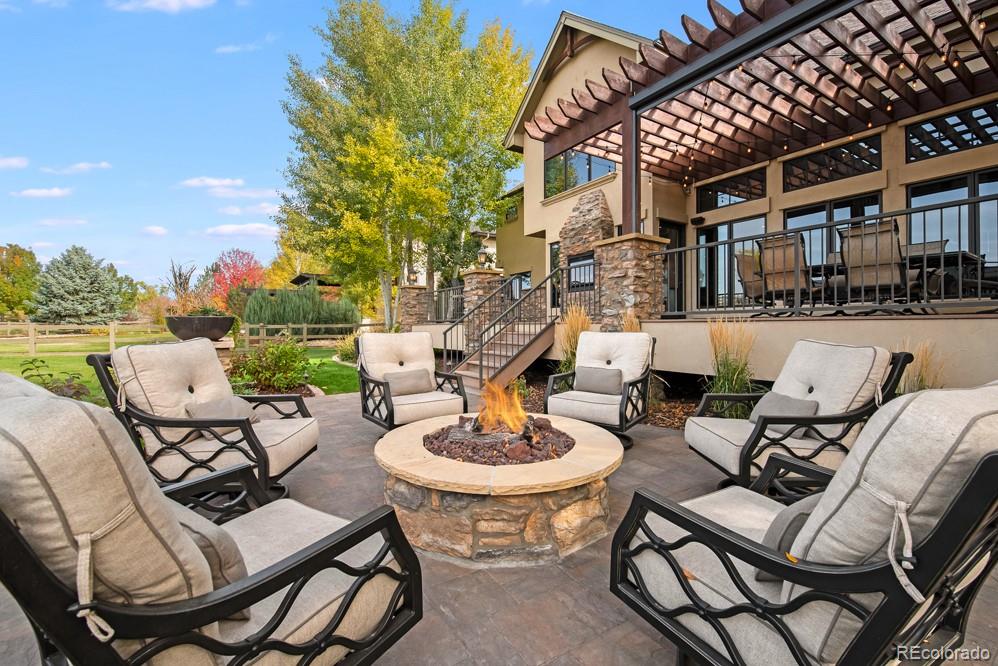 6570 Rookery Road Fort Collins, CO 80528 - Photo 40 of 40 a view of a patio with swimming pool table and chairs