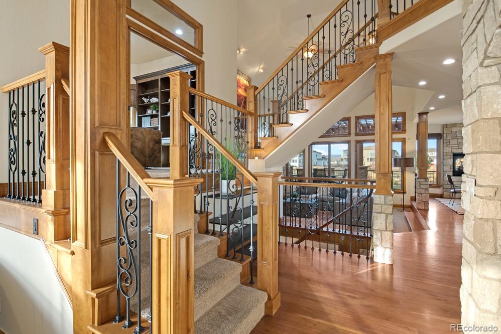 6570 Rookery Road Fort Collins, CO 80528 - Photo 4 of 40 a view of entryway and hall with dining room and wooden floor