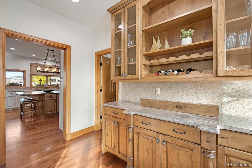 6570 Rookery Road Fort Collins, CO 80528 - Photo 7 of 40 a view of a kitchen counter space with wooden floor