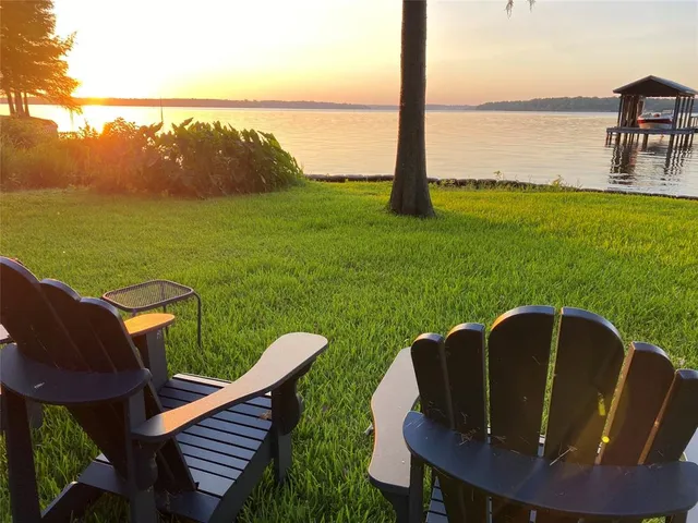 a view of a chairs and table in the patio