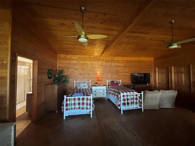 a balcony with furniture and a flat screen tv