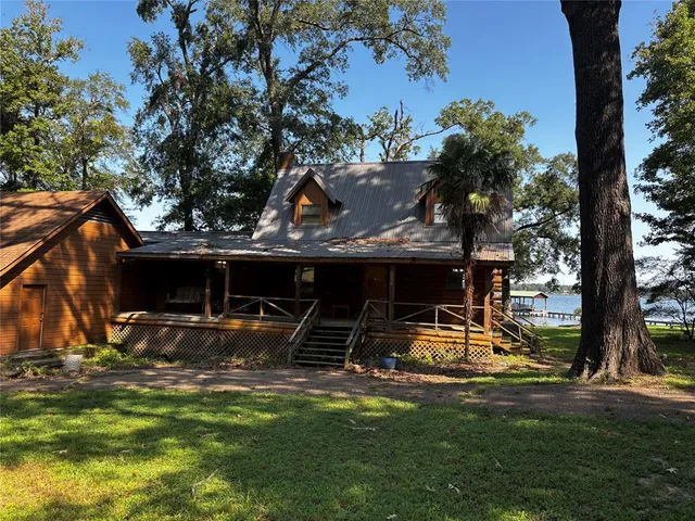 a view of a house with backyard and a slide
