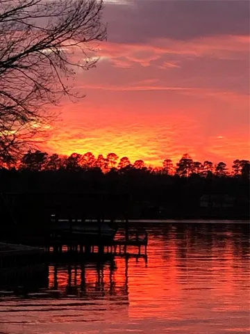 a view of ocean with sunset