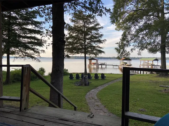 a view of a street with large trees