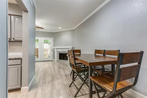 a view of a dining room with furniture and a fireplace