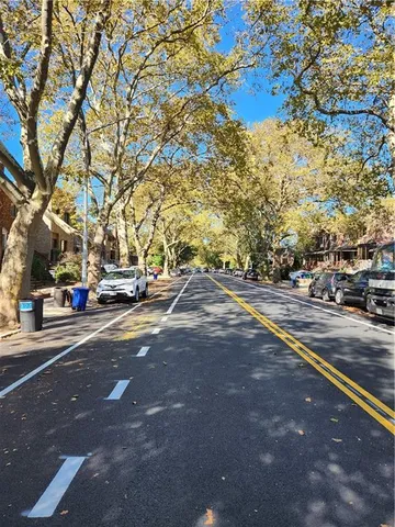 a view of street with parked cars