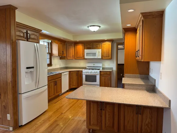 a kitchen with a refrigerator a sink and dishwasher