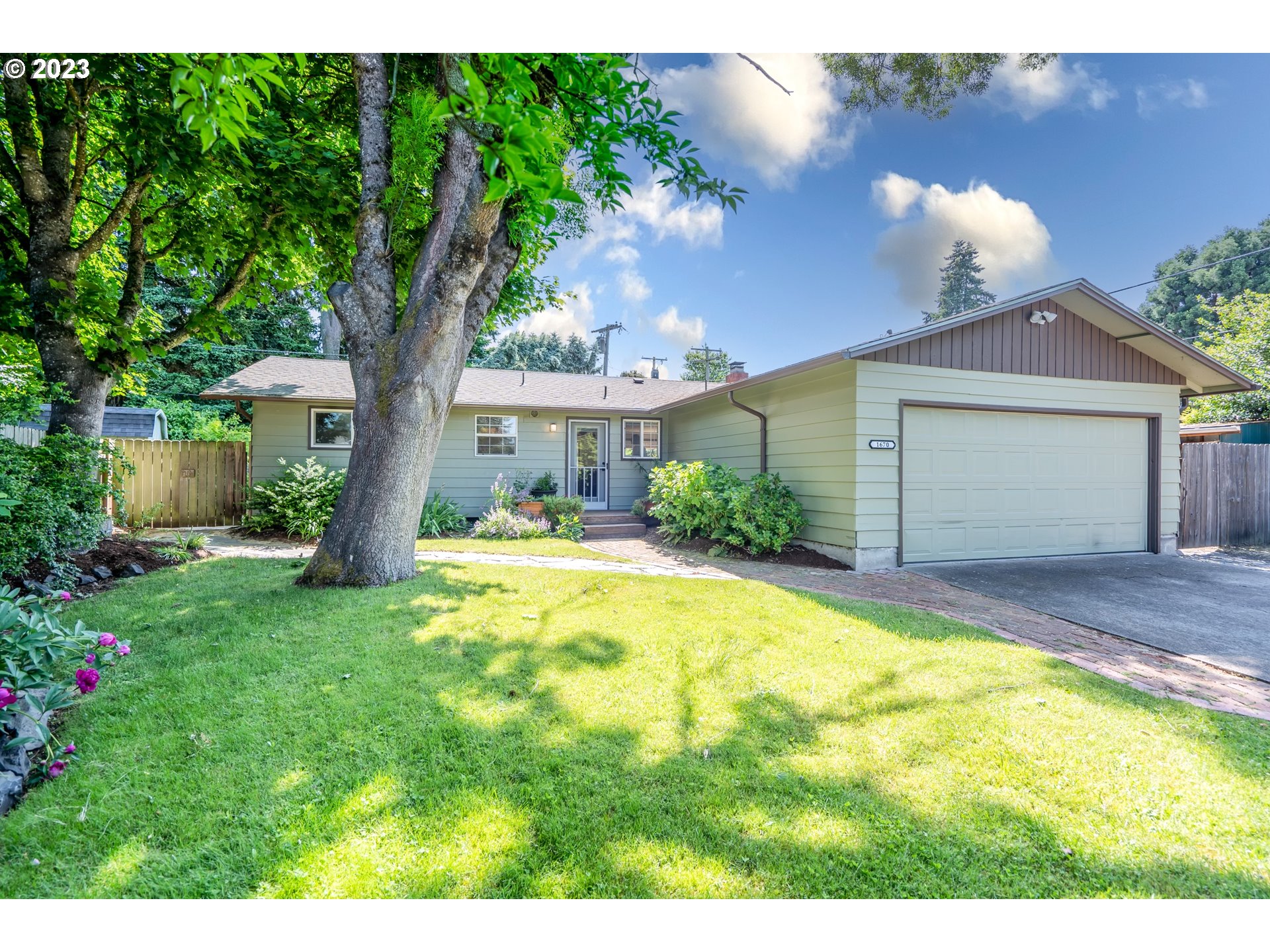 1670 Linden Avenue Springfield, OR 97477 - Photo 1 of 28 a house view with a garden space