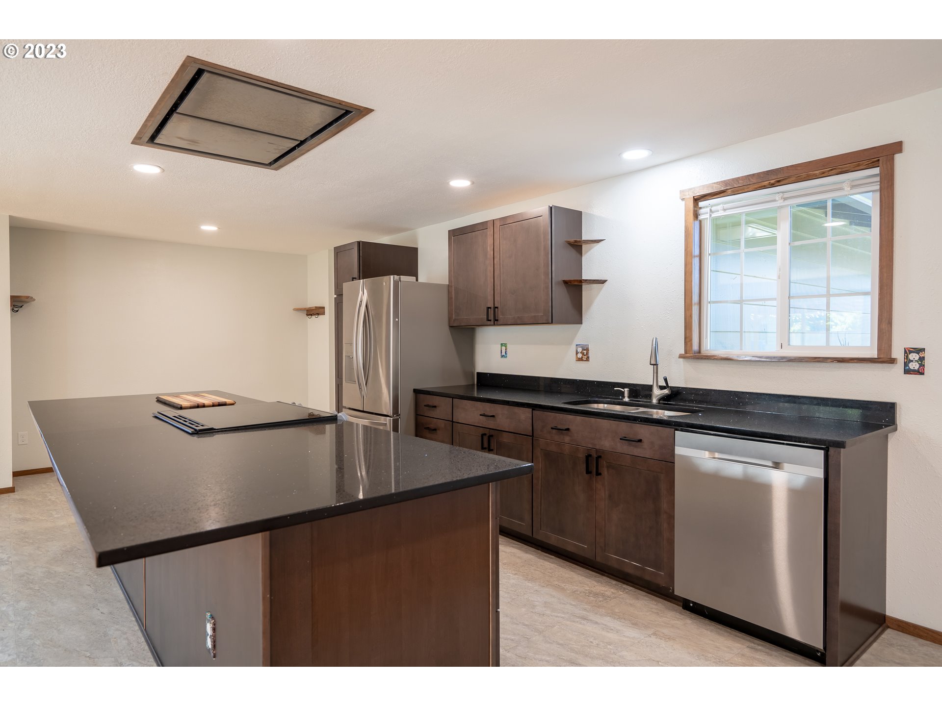 1670 Linden Avenue Springfield, OR 97477 - Photo 11 of 28 a kitchen with stainless steel appliances granite countertop a sink stove and refrigerator