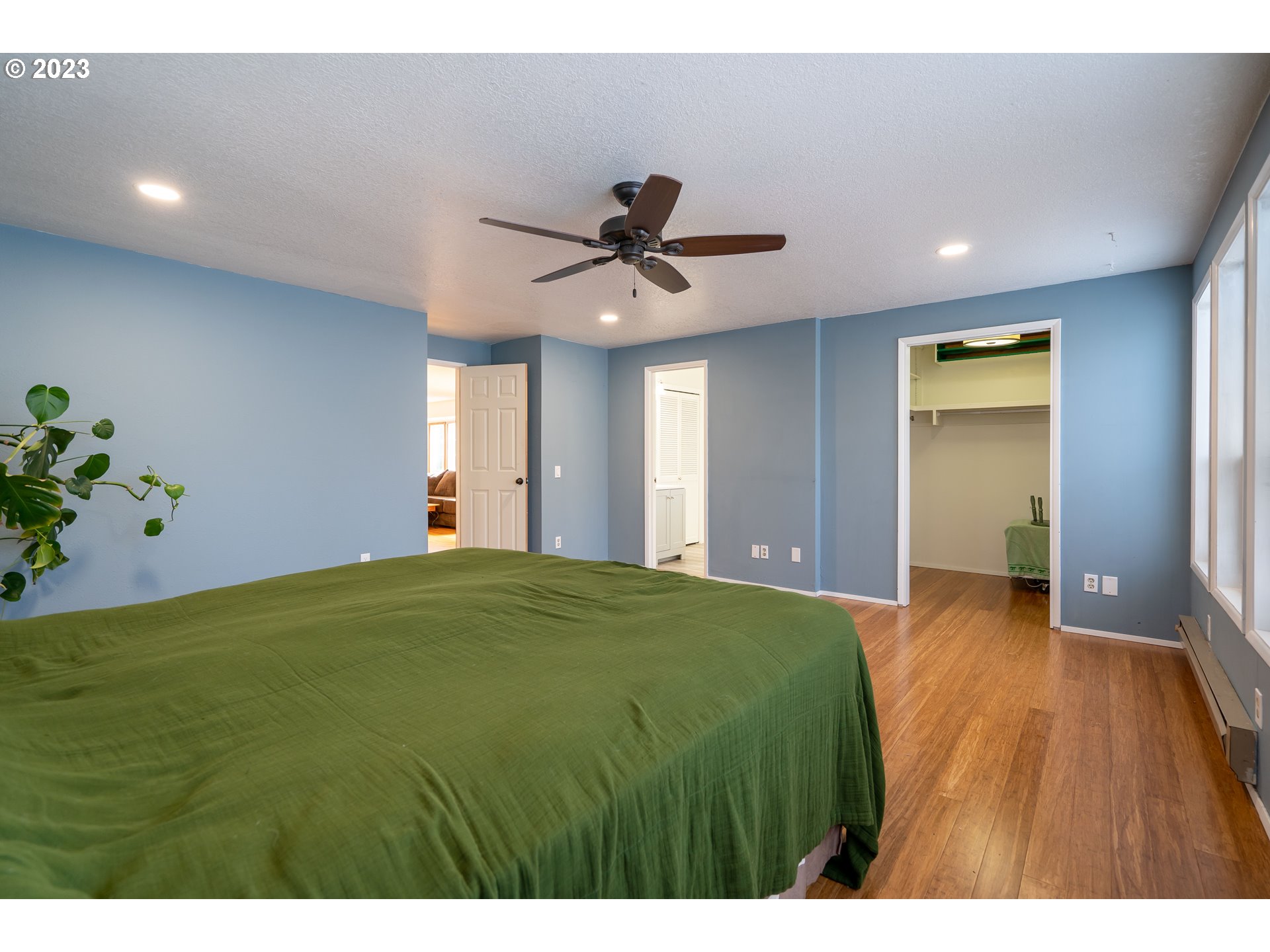 1670 Linden Avenue Springfield, OR 97477 - Photo 13 of 28 a bedroom with a bed and a chandelier
