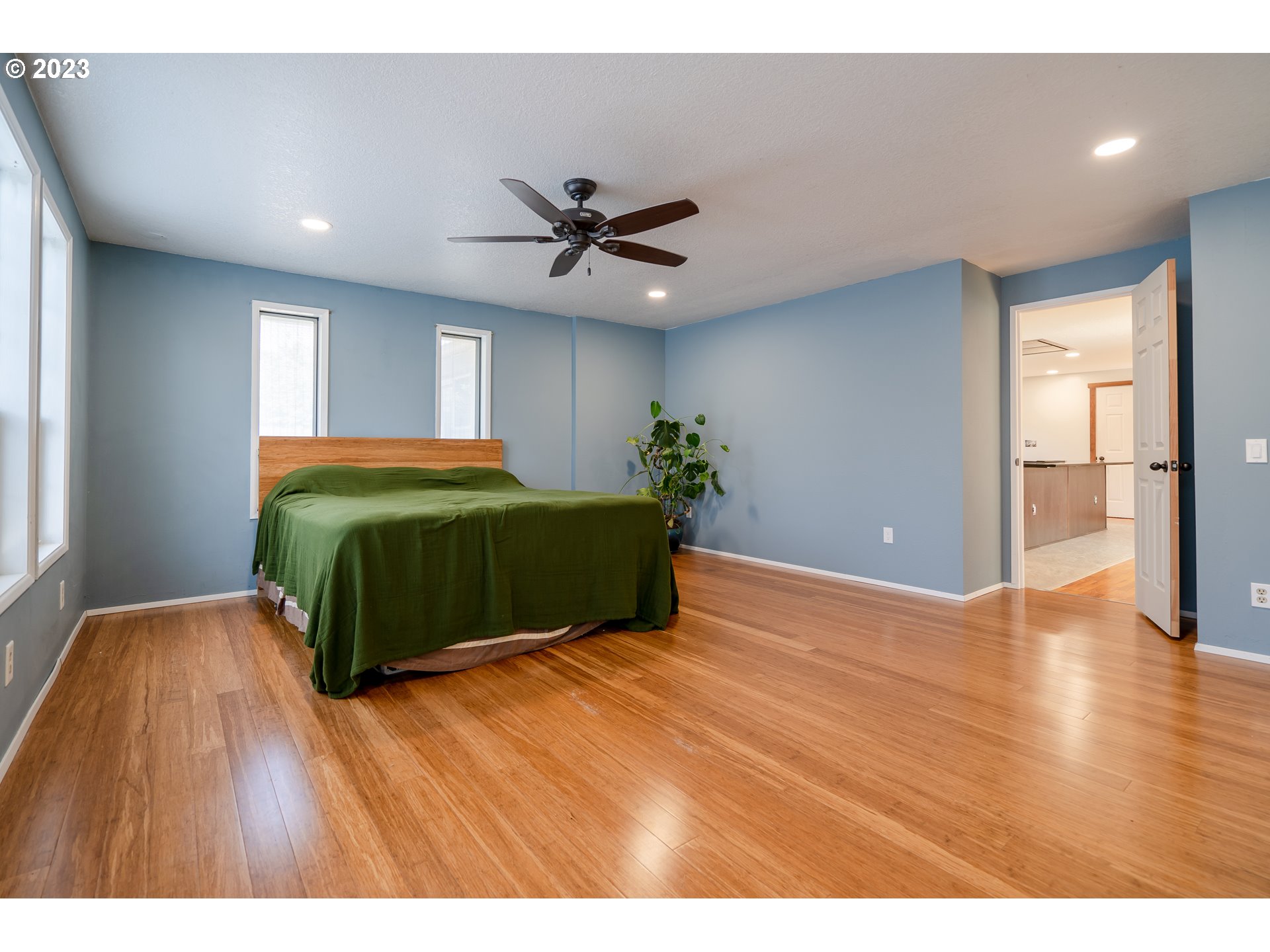 1670 Linden Avenue Springfield, OR 97477 - Photo 14 of 28 a bedroom with a bed and a wooden floor