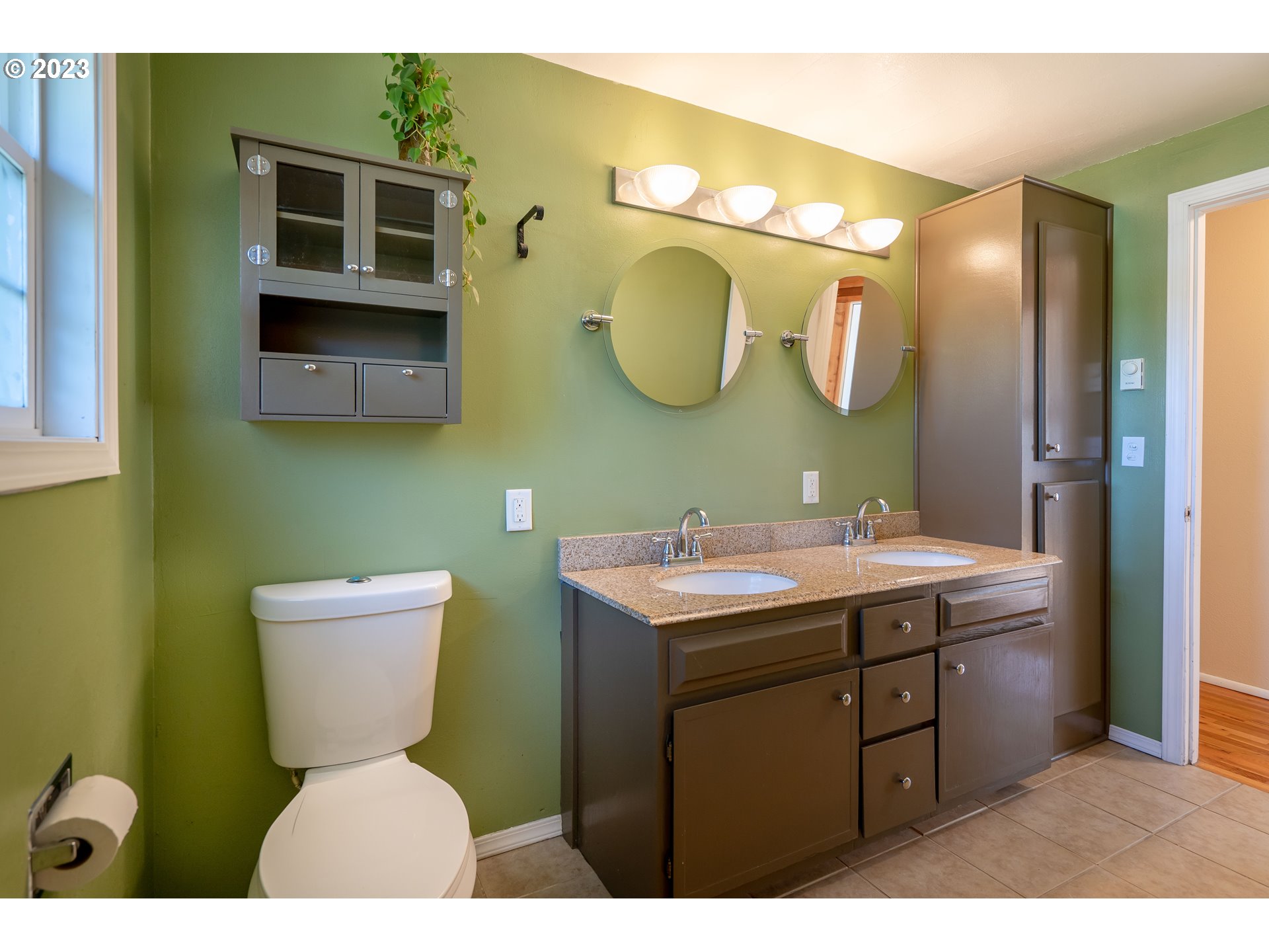 1670 Linden Avenue Springfield, OR 97477 - Photo 18 of 28 a bathroom with a toilet sink and mirror