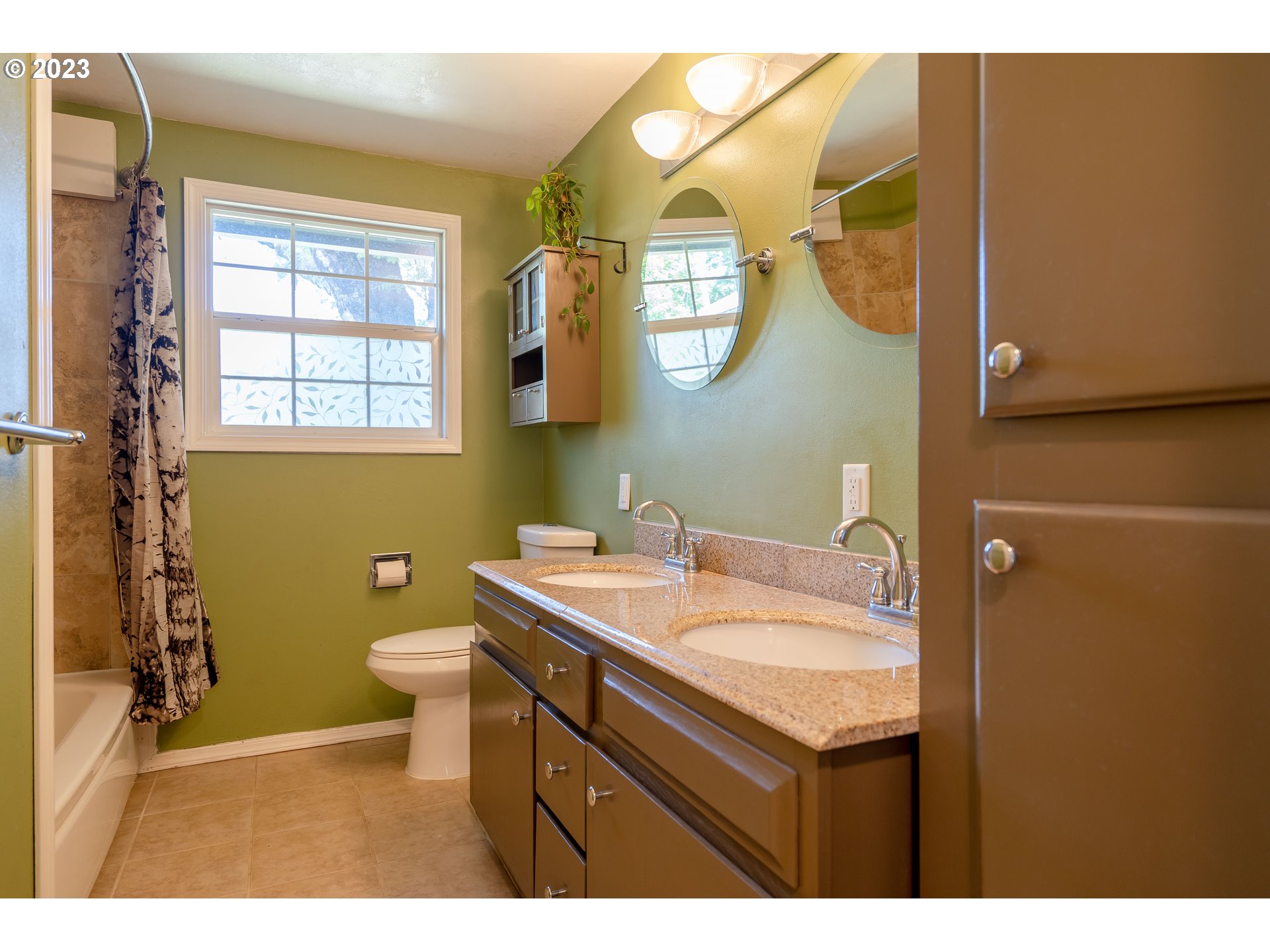 1670 Linden Avenue Springfield, OR 97477 - Photo 19 of 28 a bathroom with a sink mirror and a toilet