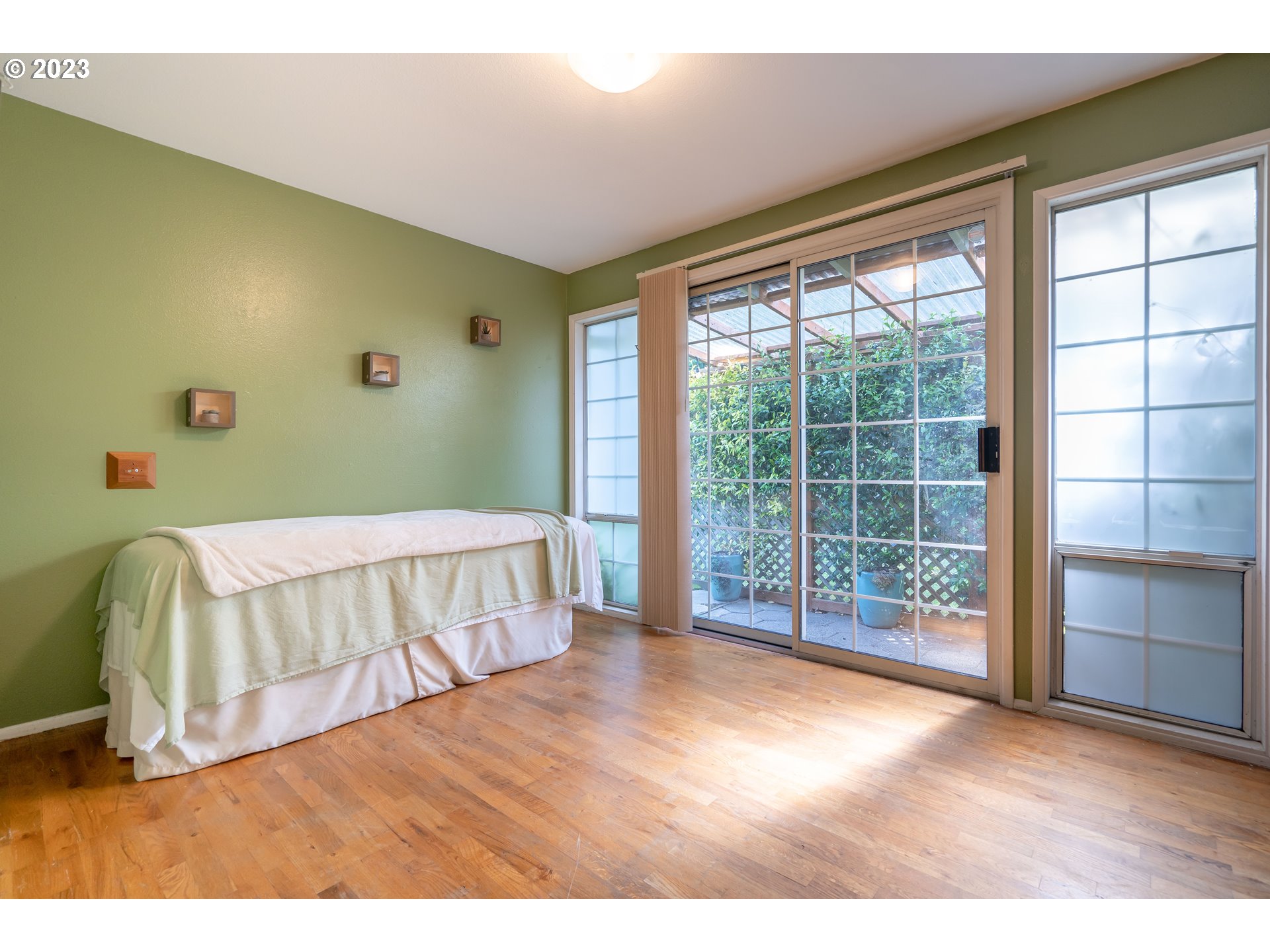 1670 Linden Avenue Springfield, OR 97477 - Photo 21 of 28 a bedroom with a bed and wooden floor
