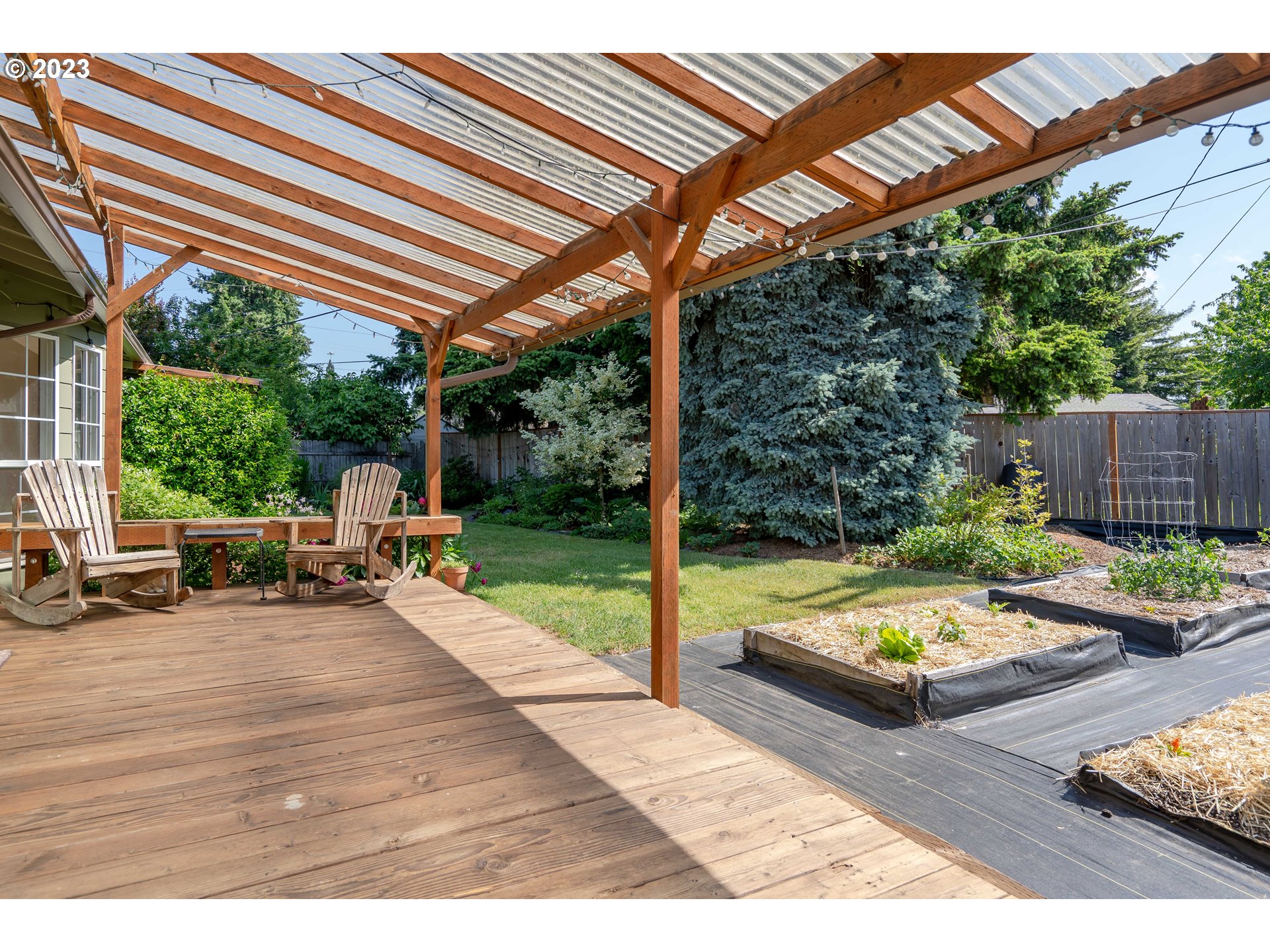 1670 Linden Avenue Springfield, OR 97477 - Photo 26 of 28 a view of swimming pool with chairs and wooden fence