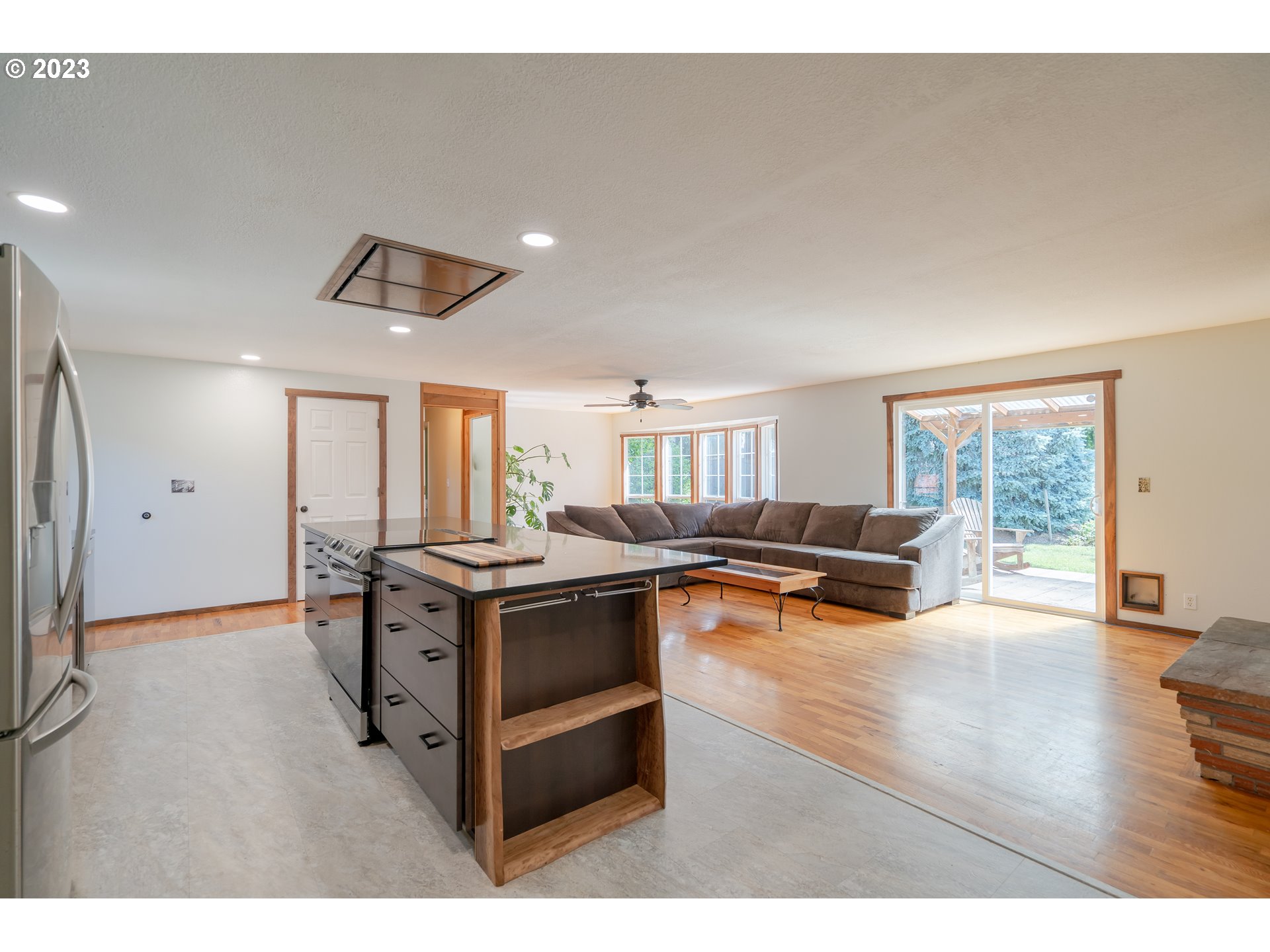 1670 Linden Avenue Springfield, OR 97477 - Photo 4 of 28 a kitchen with stainless steel appliances granite countertop a stove and a refrigerator