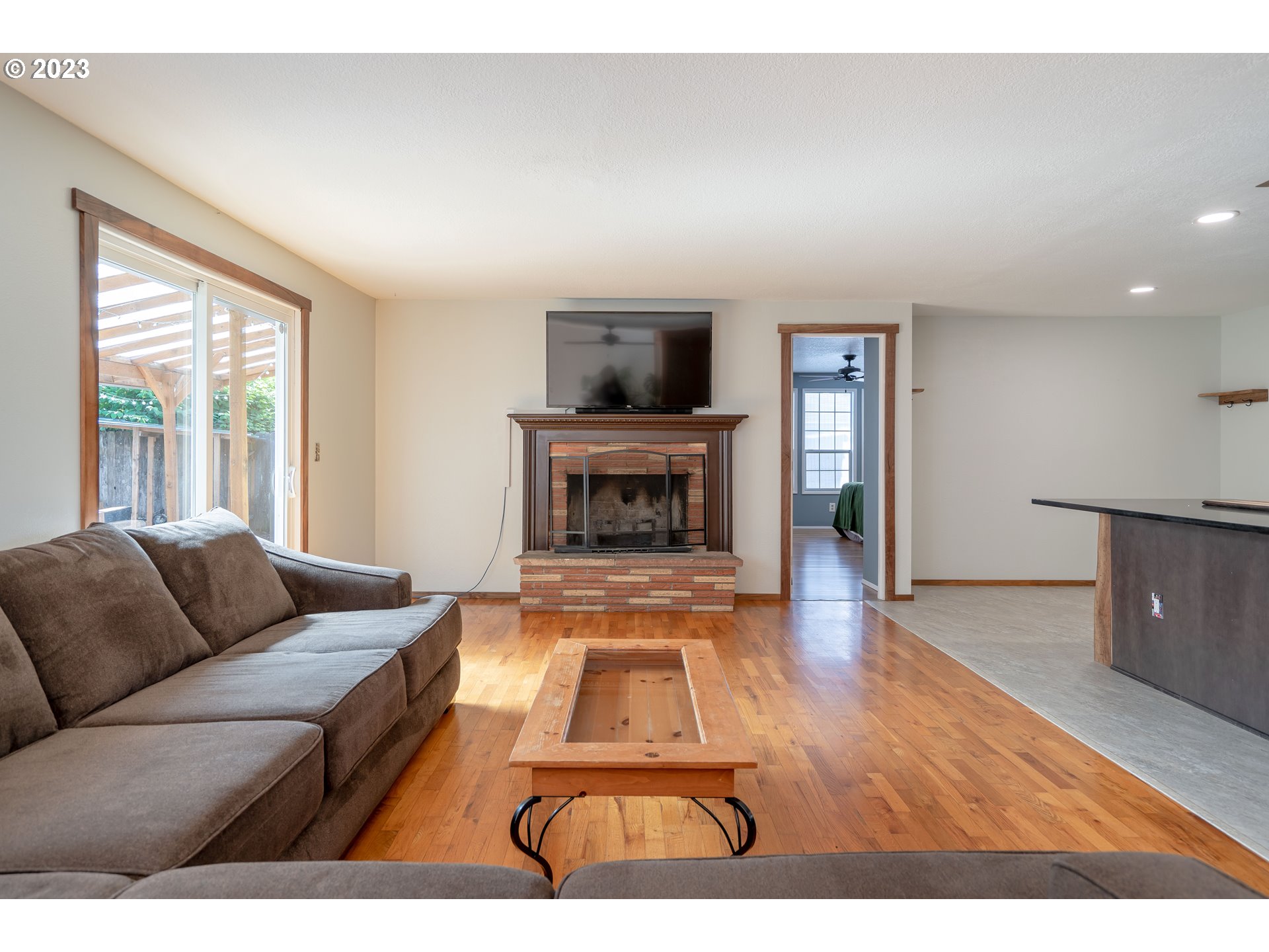 1670 Linden Avenue Springfield, OR 97477 - Photo 6 of 28 a living room with furniture and a fireplace