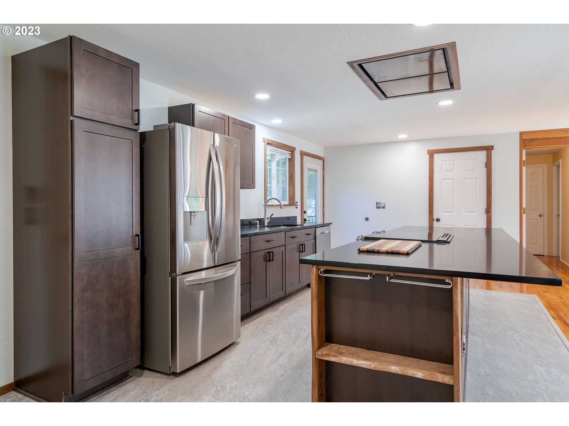 1670 Linden Avenue Springfield, OR 97477 - Photo 9 of 28 a kitchen with kitchen island a counter top space cabinets and stainless steel appliances