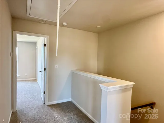 a front view of a residential apartment building with a yard