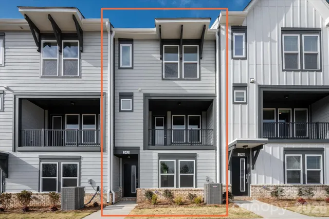 a front view of a building with balcony