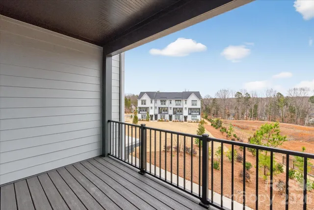 a view of balcony with wooden floor