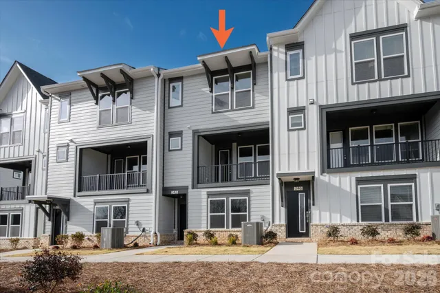 a front view of a building with parking space