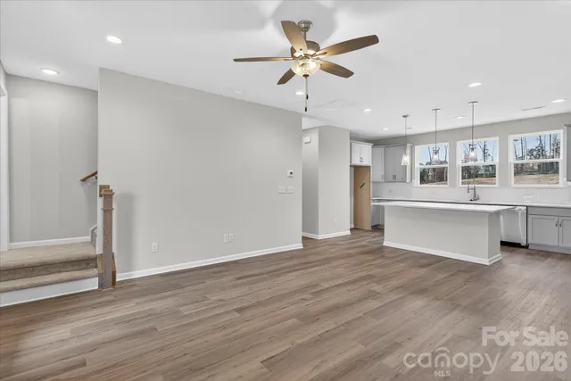 a view of a kitchen with a sink and a window