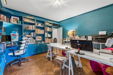 a view of a workspace with furniture
