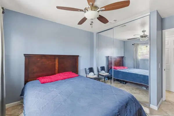 a bedroom with a bed and a table
