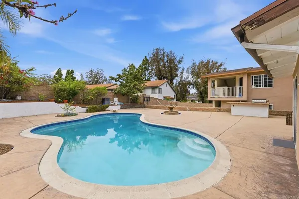 a view of a house with swimming pool