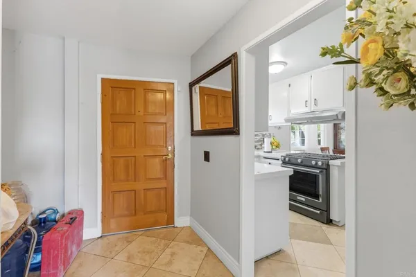 a kitchen with stainless steel appliances granite countertop a stove and a refrigerator