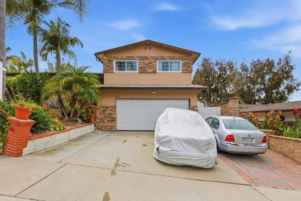 a car parked in front of a house