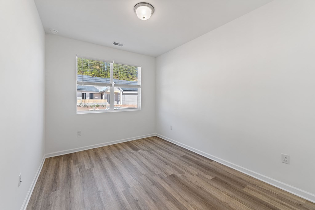31 Grove Loop Blue Ridge, GA 30513 - Photo 20 of 47 an empty room with wooden floor and windows