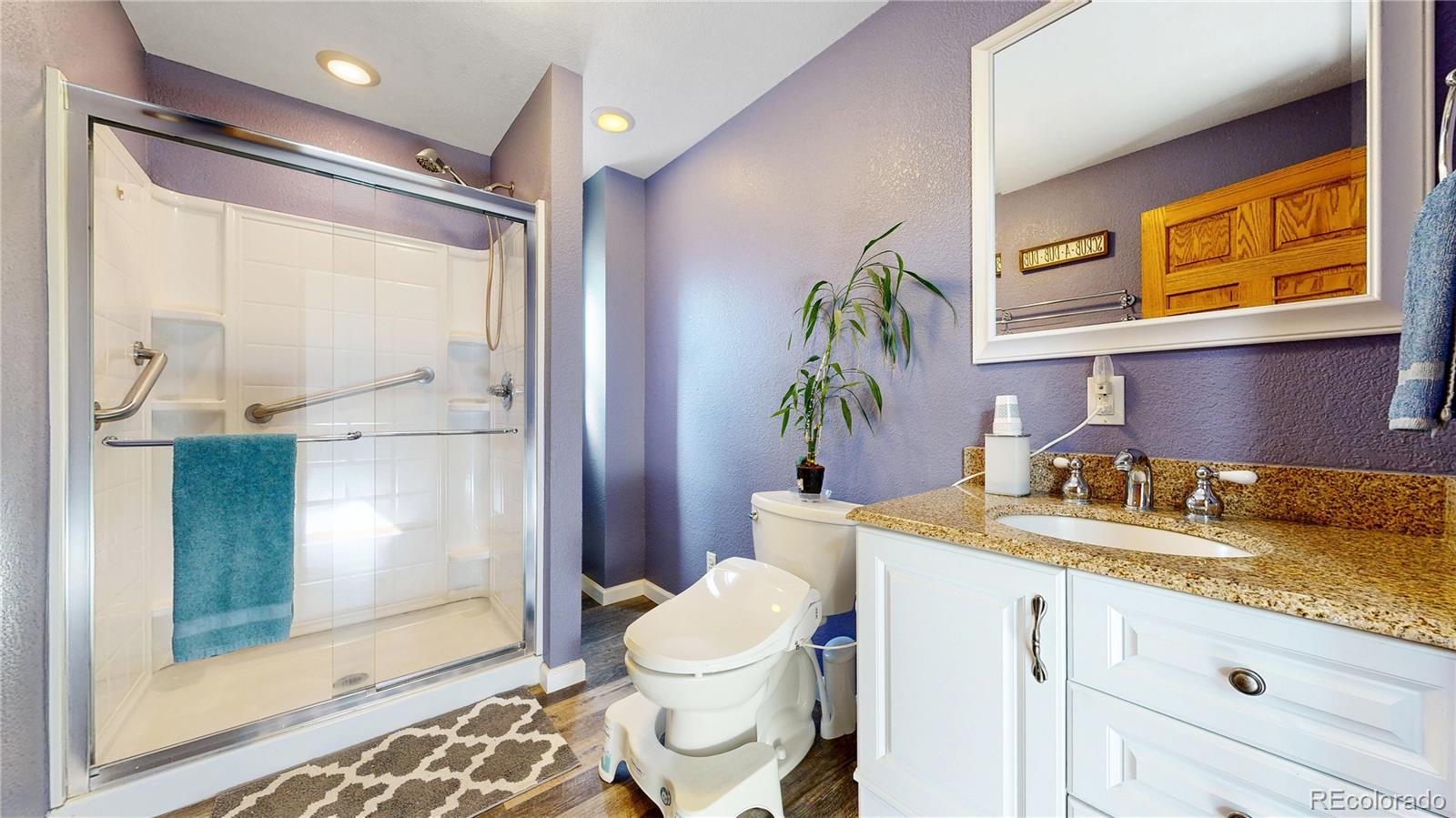 92 Four Bits Street Bailey, CO 80421 - Photo 12 of 50 a bathroom with a granite countertop sink toilet and shower