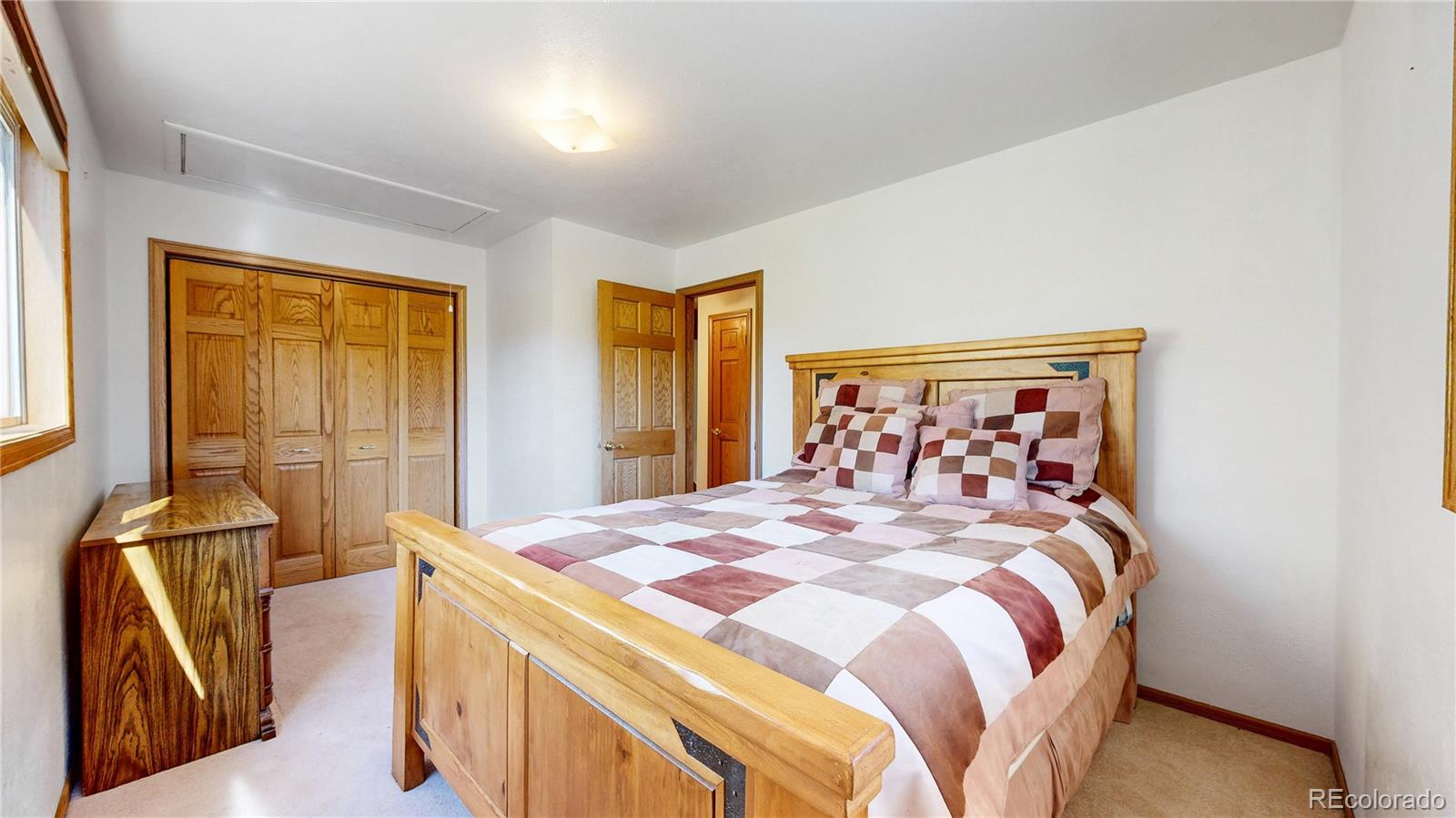 92 Four Bits Street Bailey, CO 80421 - Photo 14 of 50 a bedroom with a bed and wooden floor