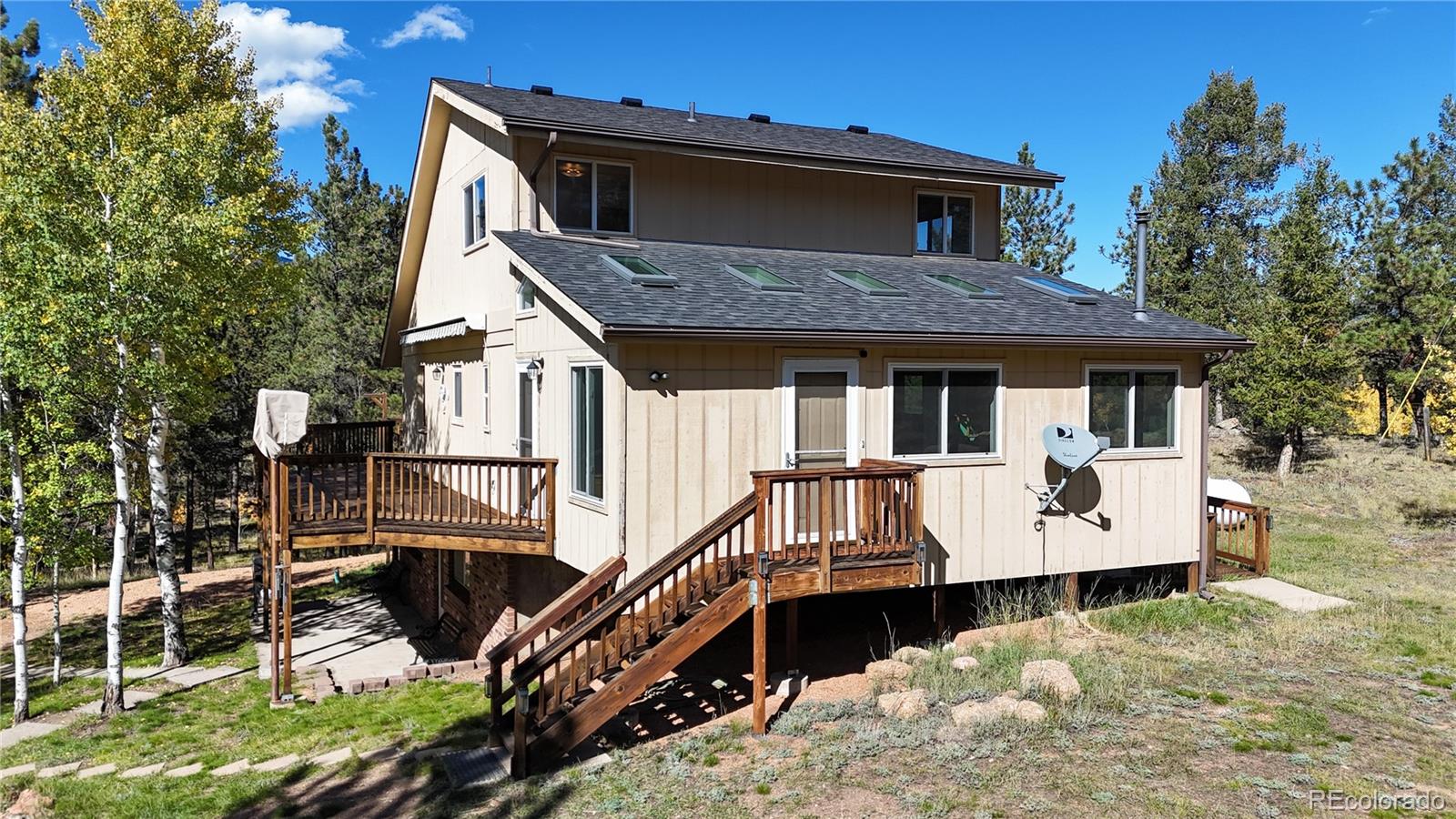 92 Four Bits Street Bailey, CO 80421 - Photo 2 of 50 a house with trees in front of it