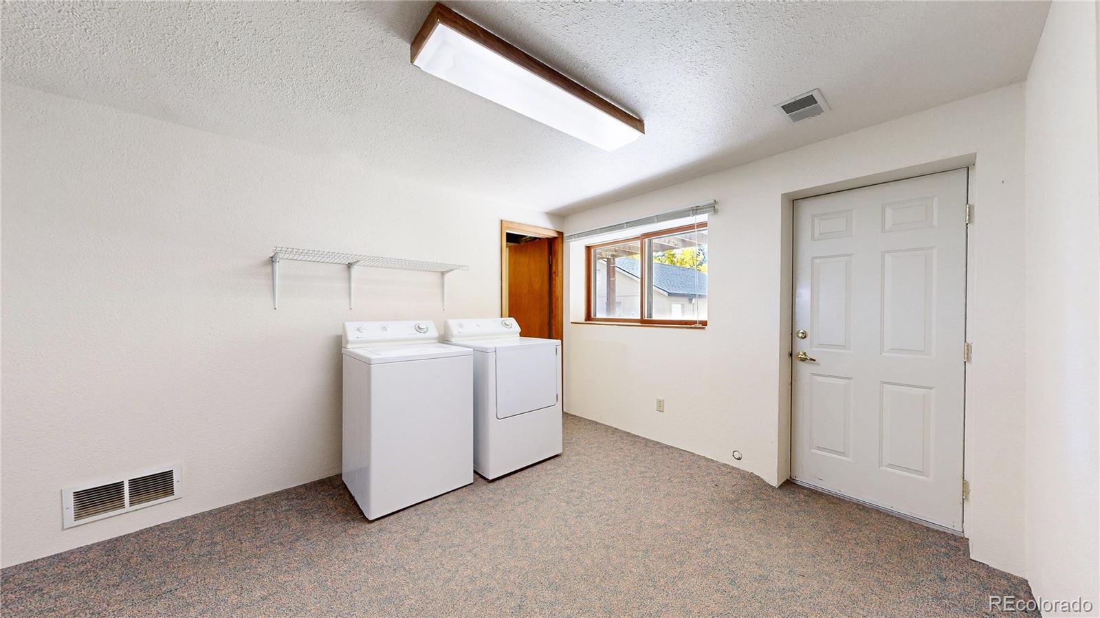 92 Four Bits Street Bailey, CO 80421 - Photo 22 of 50 a view of utility room with washer and dryer