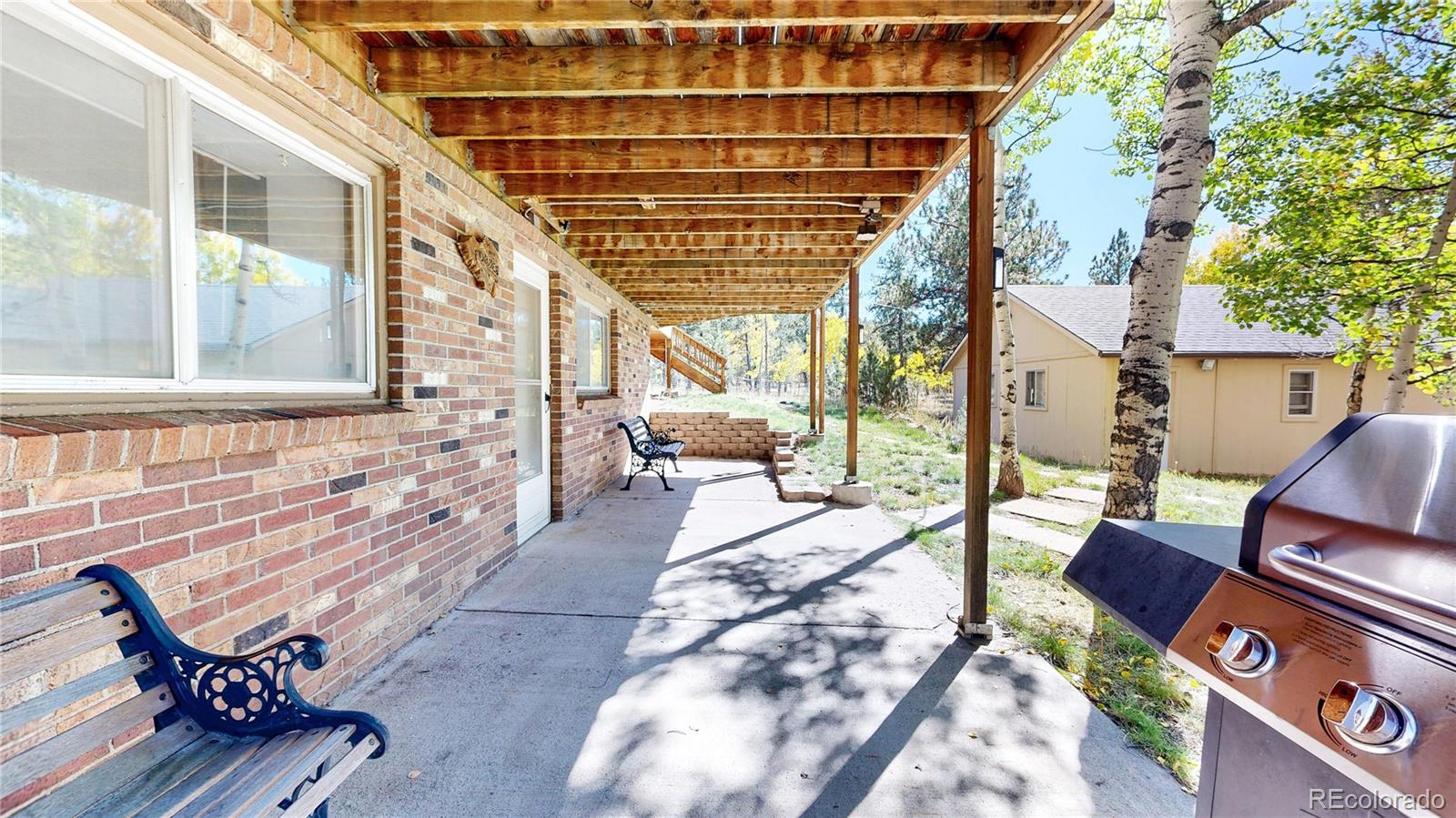 92 Four Bits Street Bailey, CO 80421 - Photo 28 of 50 a building outdoor space with patio furniture