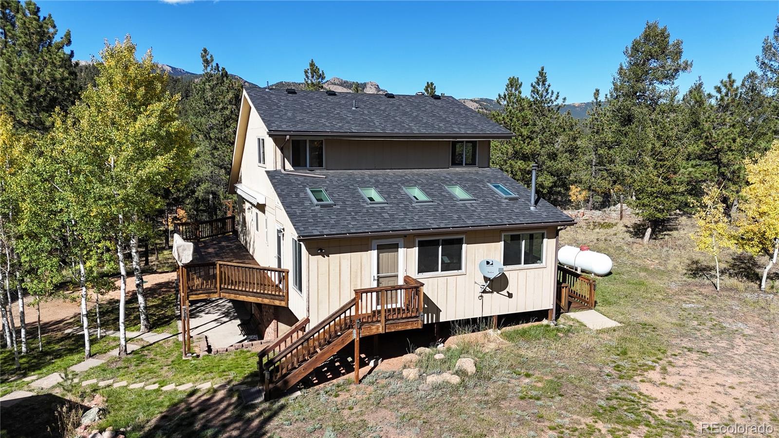 92 Four Bits Street Bailey, CO 80421 - Photo 35 of 50 a aerial view of a house with table and chairs