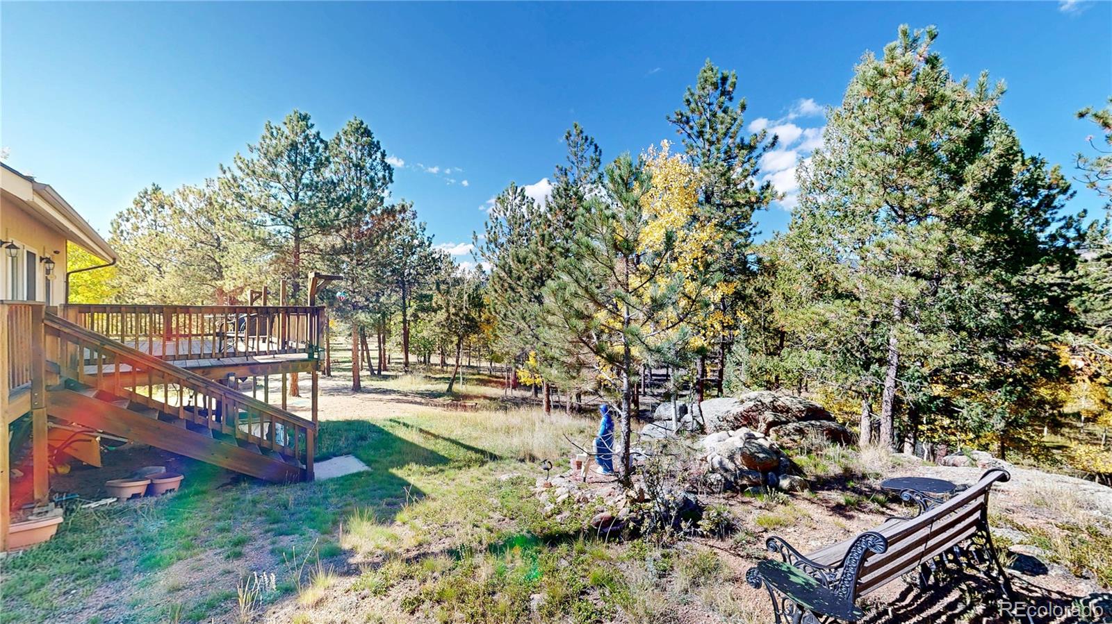 92 Four Bits Street Bailey, CO 80421 - Photo 38 of 50 a view of a backyard with sitting area